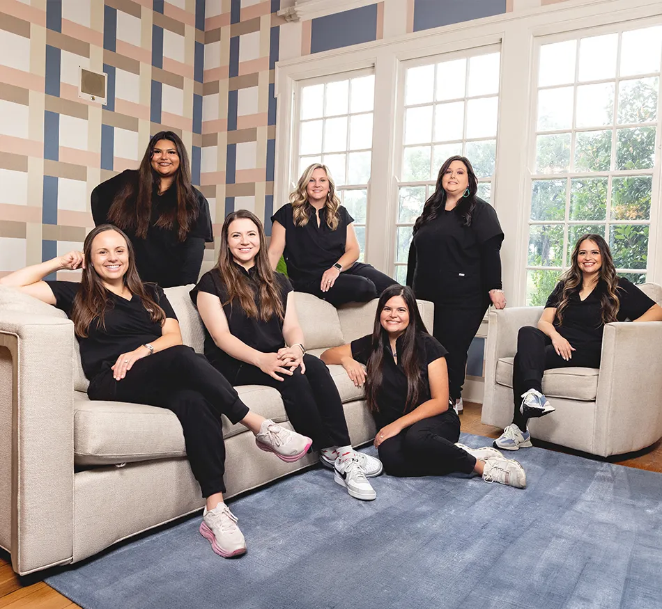 The smiling dentists and team members at Keep Smiling Waco